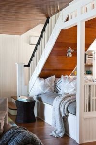 White staircase and under stairs reading nook