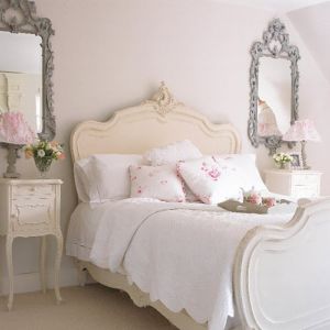 Twin mirrors in a romantic bedroom