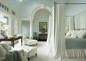 Canopy bed with gorgeous white curtains
